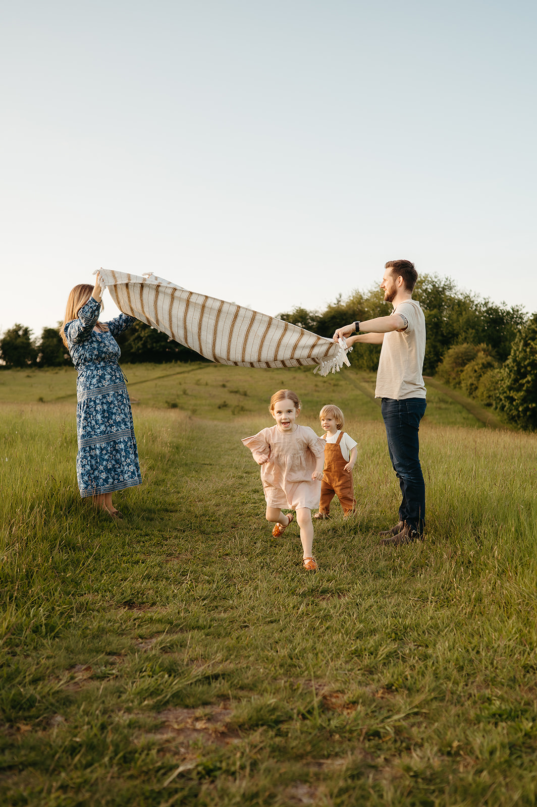 portland family in a lush field during spring golden hour