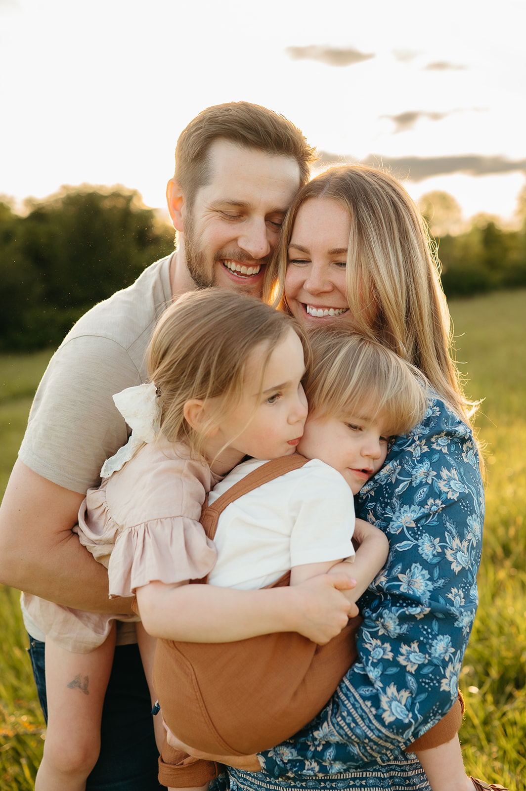 portland family in a lush field during spring golden hour