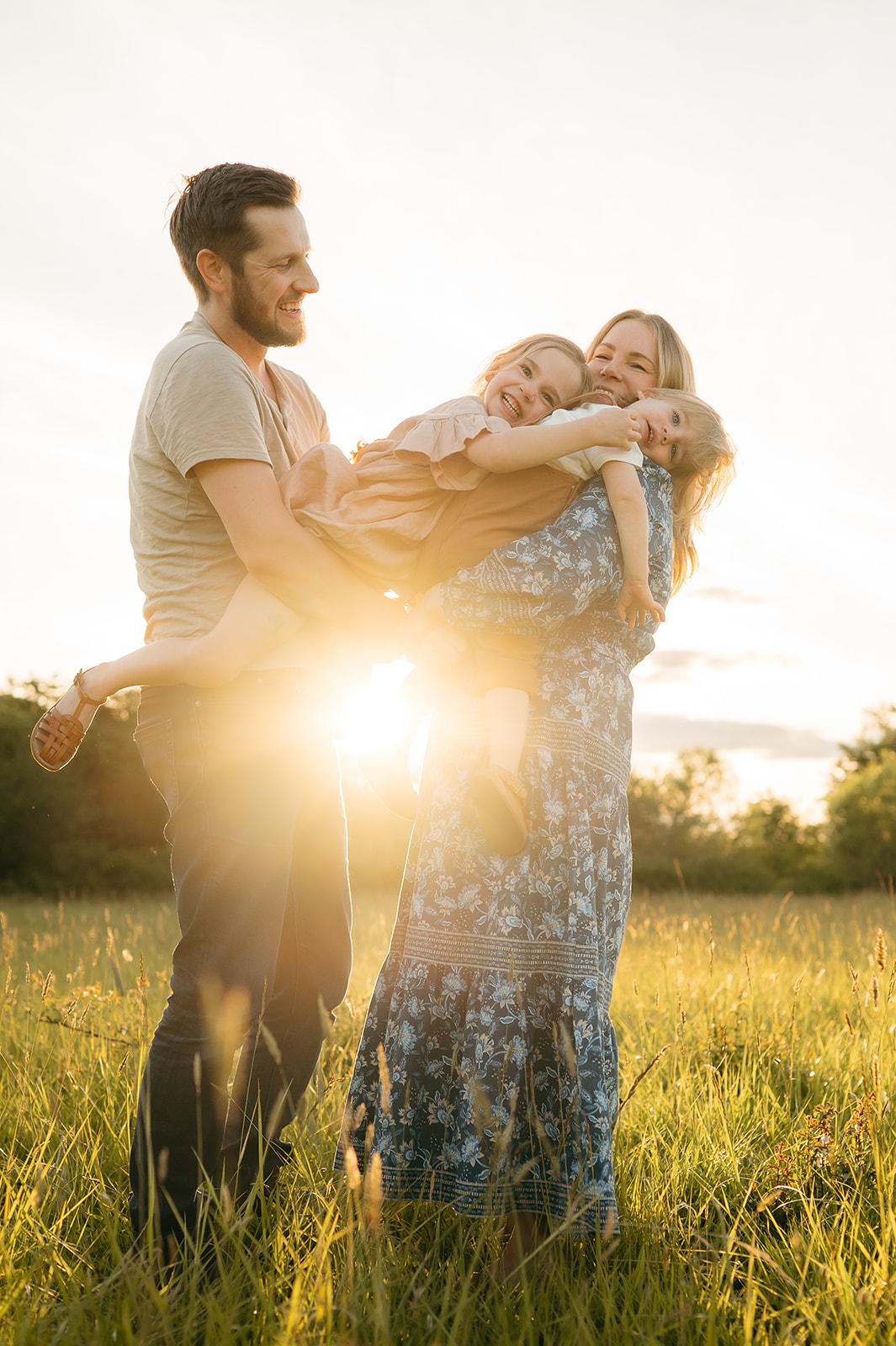 portland family in a lush field during spring golden hour