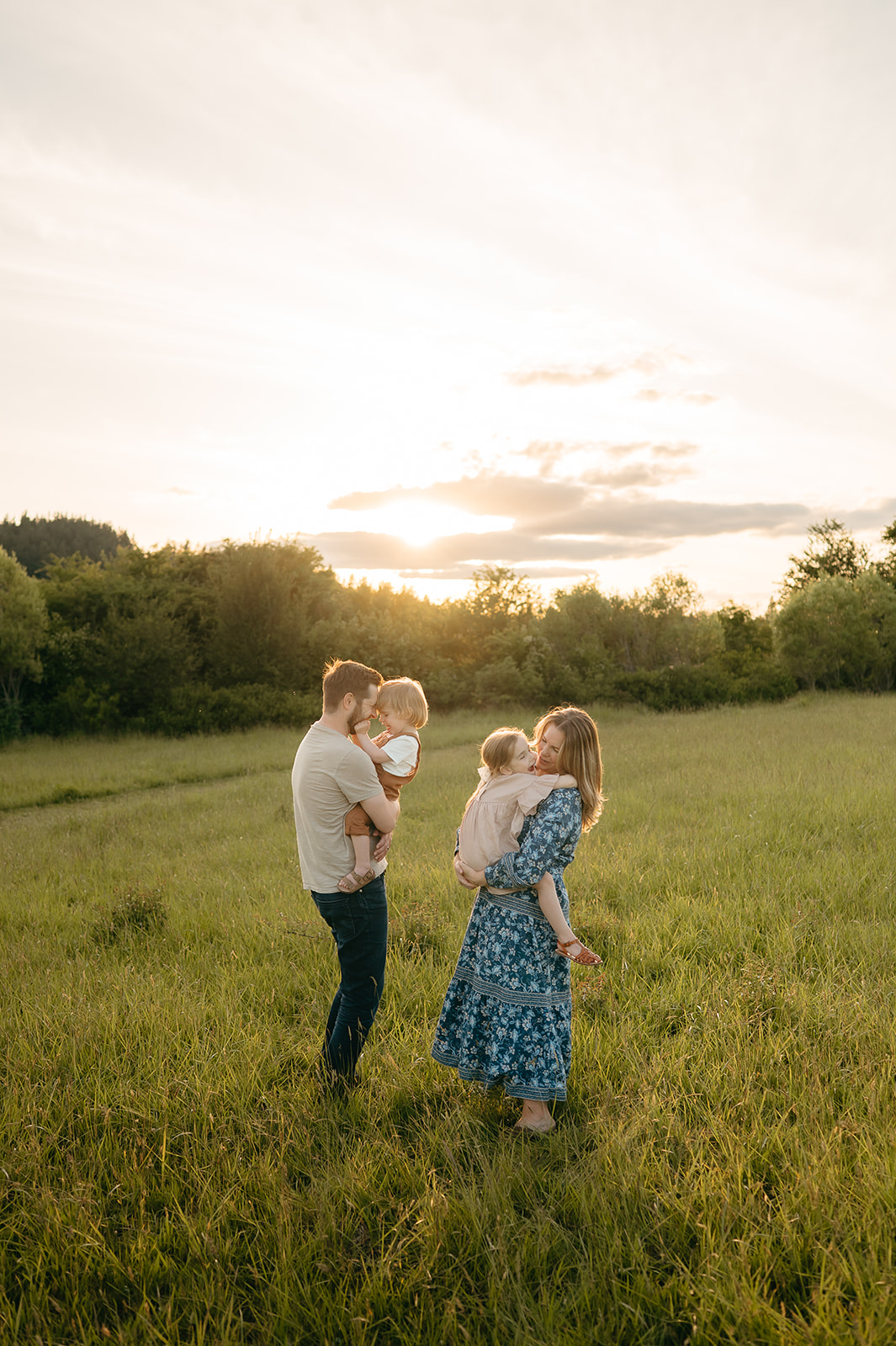 portland family in a lush field during spring golden hour