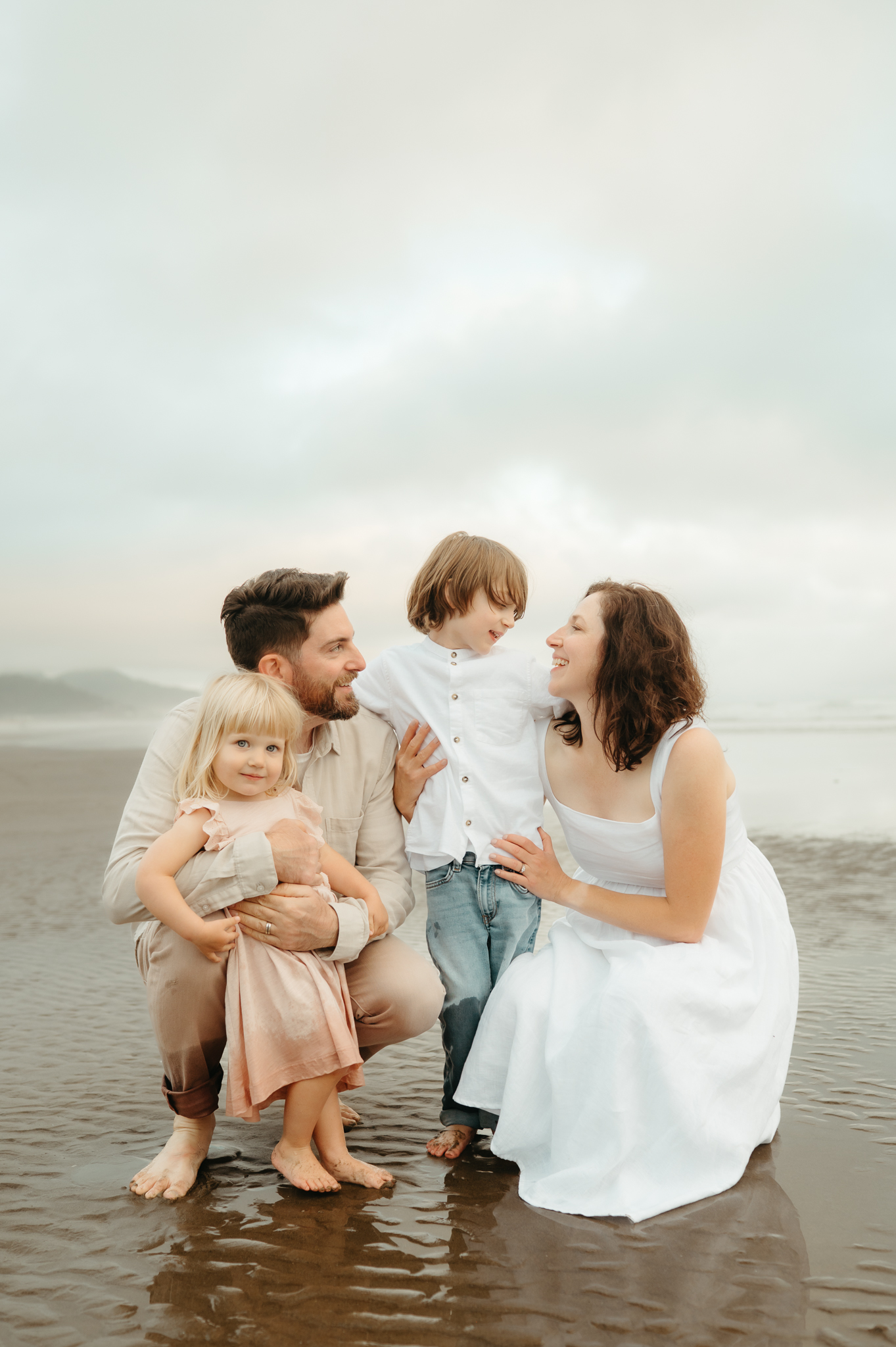 portland family at the oregon coast with soft glowy light