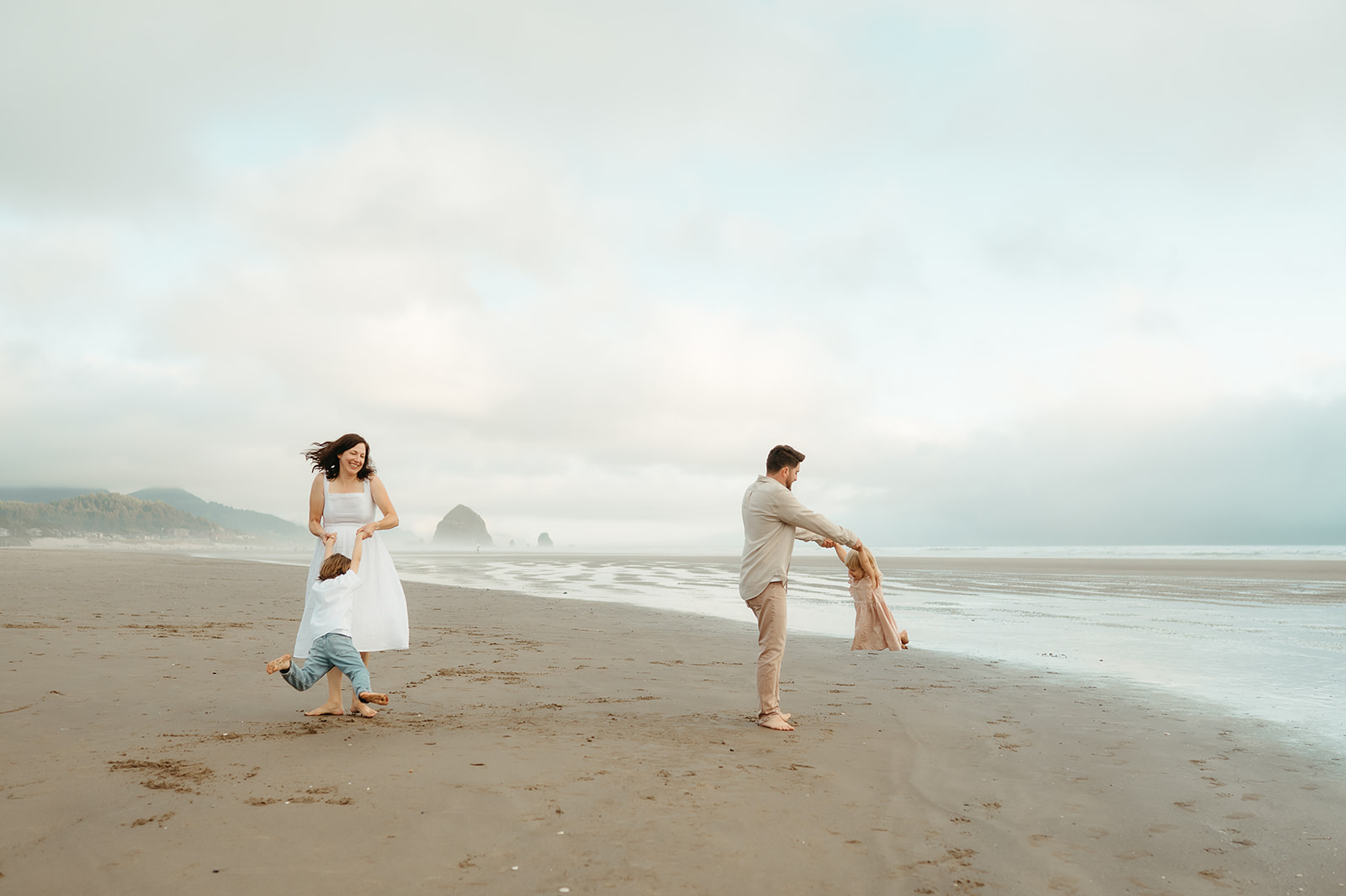 portland family playing at the oregon coast
