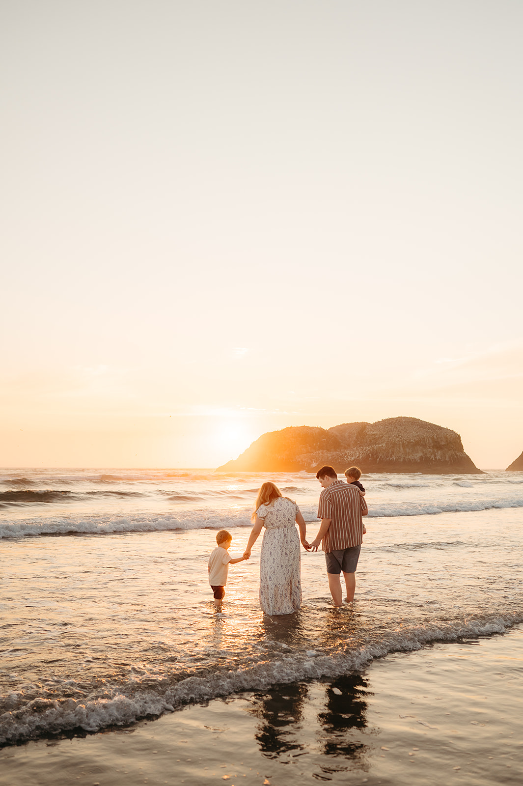 portland family playing at the oregon coast
